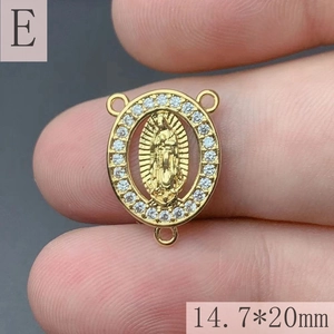 Detail of gold-plated Guadalupe oval pendant with white cubic zirconia and three rings