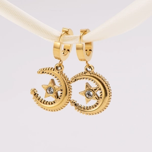 Golden stainless steel hoop earrings with moon and star pendants and sparkling crystals