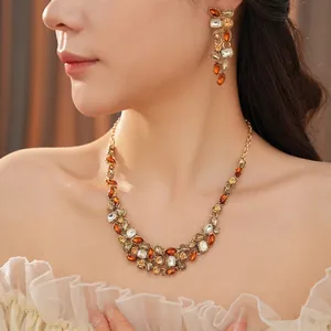 Vintage style crystal droplet jewelry set with necklace and earrings in amber gold tones