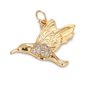 Detailed close-up of a golden hummingbird pendant featuring sparkling clear cubic zirconia