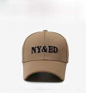 Front view of khaki baseball cap with black embroidered letters and curved brim
