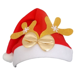 Detail of red Christmas hat with plush white brim and sparkling golden antlers