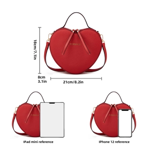 Detailed size dimensions of red heart shaped crossbody bag with smartphone comparison