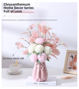 Pink ceramic vase detail with geometric facets and faux chrysanthemum eucalyptus bouquet
