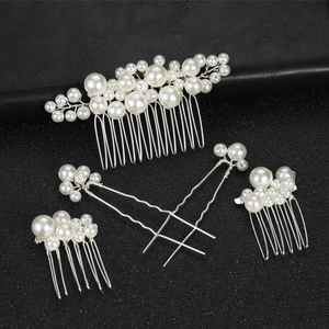 Baroque bridal hair accessories set with white faux pearls on silver wire over black background