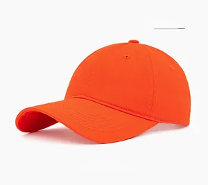 Close-up of an orange yellow cotton six-panel baseball cap with curved brim and stitching