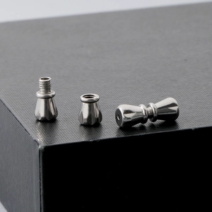 Macro shot of silver metal screw clasps for pearl necklace jewelry making parts