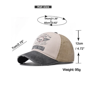 Detail of vintage skull print and distressed brim on cotton motorcycle club baseball cap