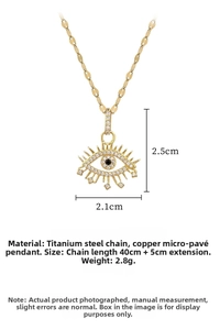 Macro shot of gold Evil Eye necklace with cubic zirconia micro-pave detailing and measurements