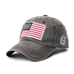 Detail view of American flag patch and USA embroidery on vintage washed cotton baseball cap