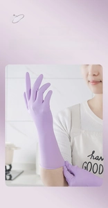 Detailed view of long purple nitrile gloves providing arm protection for kitchen cleaning