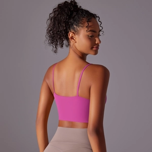 Detail of rose pink yoga tank top with thin straps and low back design for women