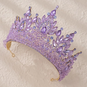 Luxurious gold bridal crown featuring teardrop purple crystals and sparkling rhinestones