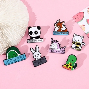 Detailed view of 7 cartoon animal enamel pins featuring a panda, fox, and rabbit on pink background