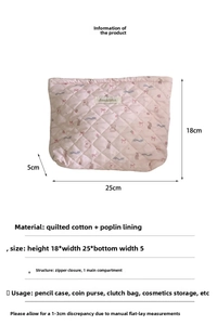 Detailed view of pink quilted cotton makeup bag with cute bear patterns and zipper closure