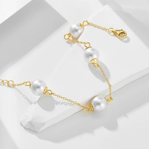 Elegant s925 sterling silver pearl bracelet in gold finish with round white pearls