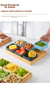 Detail of square ceramic snack bowls on bamboo tray for party serving and sauces