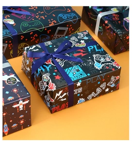 Detail of gaming themed wrapping paper featuring neon controllers and play symbols
