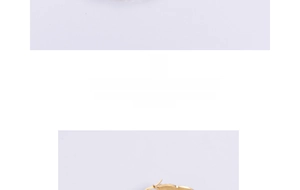 Detailed view of polished 18K gold heart-shaped stainless steel earrings with mirror finish