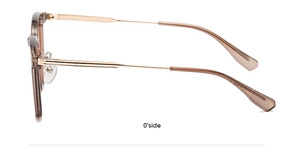 Detail view of brown translucent frame with gold metal temples and hinge assembly
