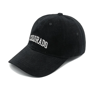 Detail of Colorado letter embroidery on a black washed cotton baseball cap
