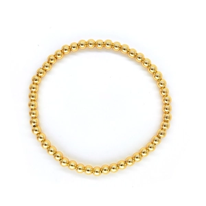 Close-up of polished 18K gold-plated beads on a multi-layer Turkish evil eye bracelet
