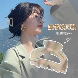 Polarized acetate hair claw clip with cream marble finish for stylish hair styling