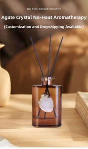 Detailed view of agate stone reed diffuser in brown glass bottle on a wooden table