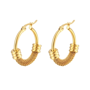 Macro detail of golden crescent hoop earrings featuring intricate woven mesh textures