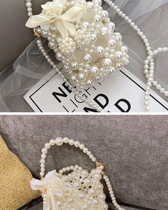 Detail of handmade cream pearl mini bag featuring a satin bow and long beaded strap