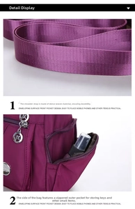 Dettaglio borsa in nylon viola con tracolla in fettuccia fitta e tasca laterale zip
