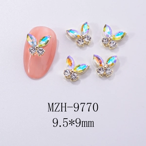 Detailed macro view of 9.5x9mm butterfly nail charms with iridescent rhinestones
