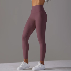 Side view of high-waisted yoga pants in matte dark mauve with lifting and shaping effect