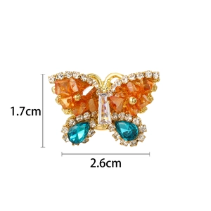 Elegant gold butterfly brooch with orange and blue rhinestones, size 2.6cm by 1.7cm