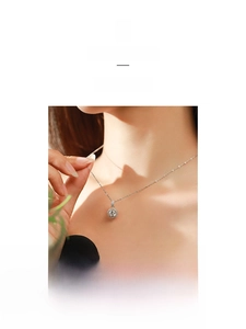 Detail of a sparkling round zircon pendant on an S925 silver O-chain worn by a model
