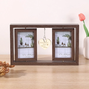 Detail of a rotating wooden photo frame featuring a golden heart charm for pet owners