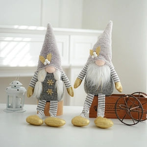 Detailed view of gray and gold Christmas gnomes with sequins on a rustic wooden base