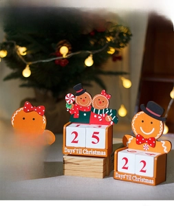 Detail of wooden gingerbread man countdown calendar with rotatable number blocks