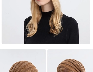 Detail showing brown ribbed knit beanie with brown leather logo patch on folded cuff