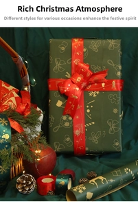 Detail of green Christmas wrapping paper and red gold-stamped ribbon with festive patterns