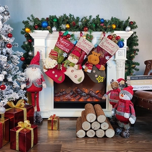 Three Christmas stockings with 3D Santa, Snowman, and Reindeer hanging on a white fireplace