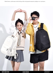 Detail view of large capacity waterproof student backpacks in black and white colors