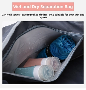 Close-up of the waterproof wet compartment in a grey travel bag with a blue towel inside