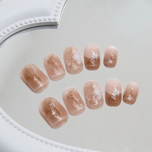 Short square floral press-on nails with autumn brown smudge art and glitter details