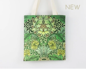 Detail of William Morris floral canvas tote bag showing intricate green plant pattern