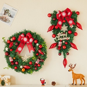 Christmas wreath and teardrop swag set with red bows and gold ornaments for holiday decor