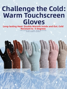 Multiple colors of winter knit gloves with touch screen tips against a snowy backdrop