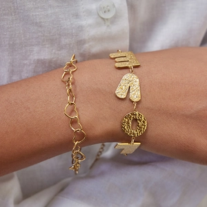 Gold layered bracelet set featuring heart links and hammered LOVE letter charms