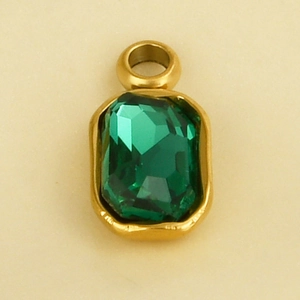 Detailed view of emerald-cut green crystal pendant in a gold-plated stainless steel frame