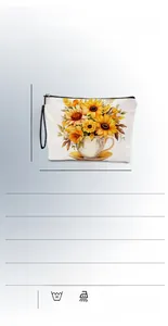 Detail of sunflower and teacup print on linen makeup bag with wristlet strap